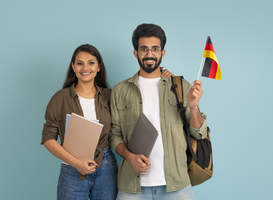 Normal_happy-young-indian-couple-students-with-flag-of-ge-2025-04-02-22-41-20-utc